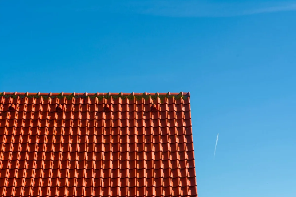 Tile roof gable in full sun, the kind of exposure that sets roof life in Oshkosh, WI